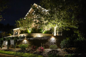 front lawn of home beautiful landscaping retaining walls recess lighting trees shrubs