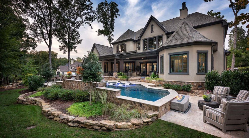 Mathews, NC backyard landscape with pool, patio, fire pit, and chairs